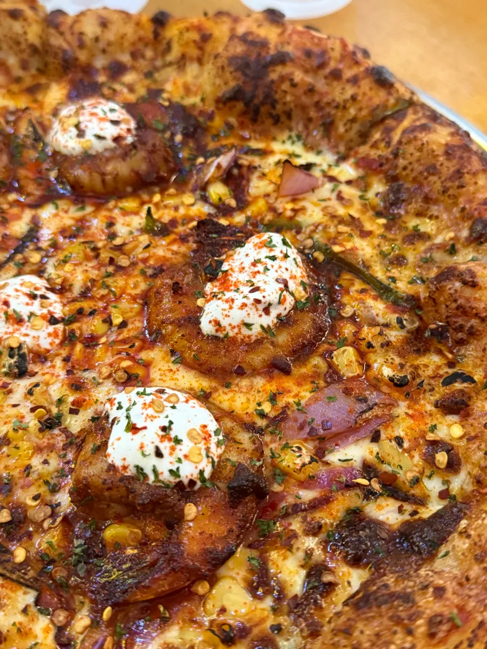 Shrimp pizza served with cilantro sauce
