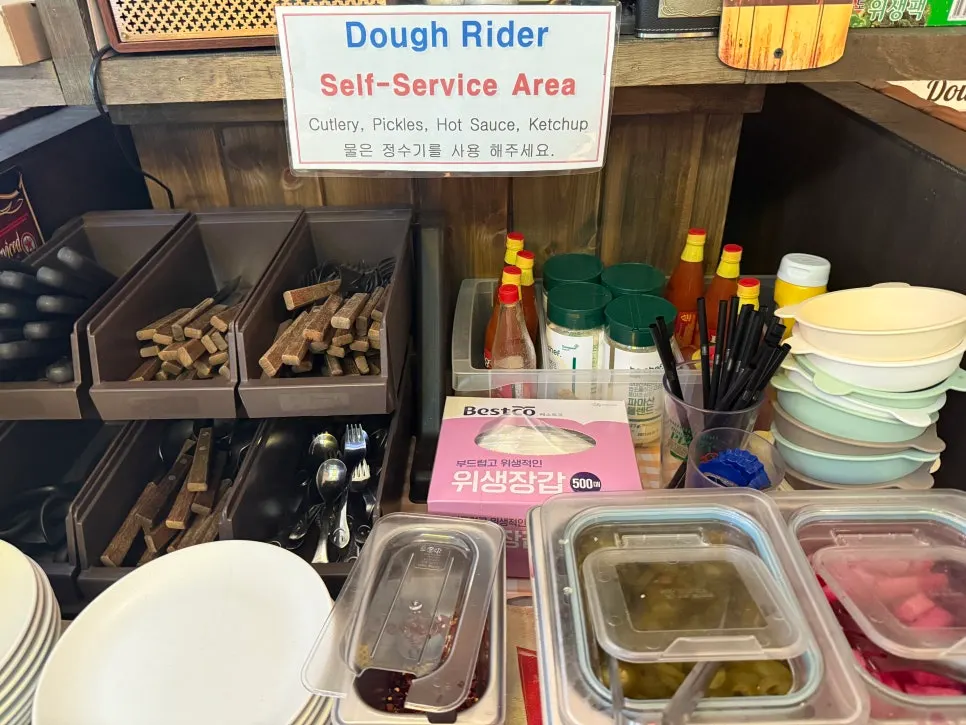 Self-bar stocked with pickles and sauces