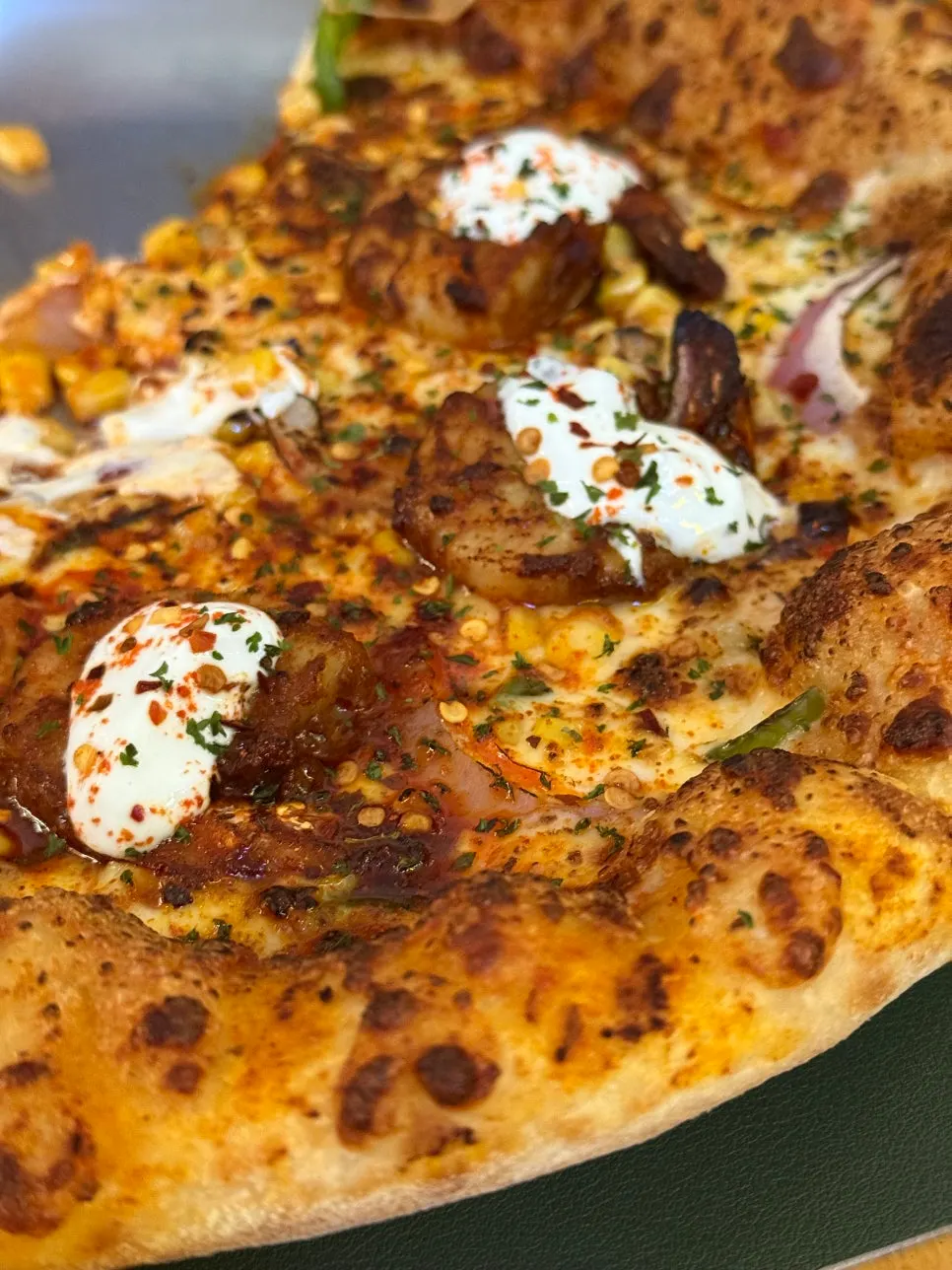 A slice of pizza with stretchy cheese