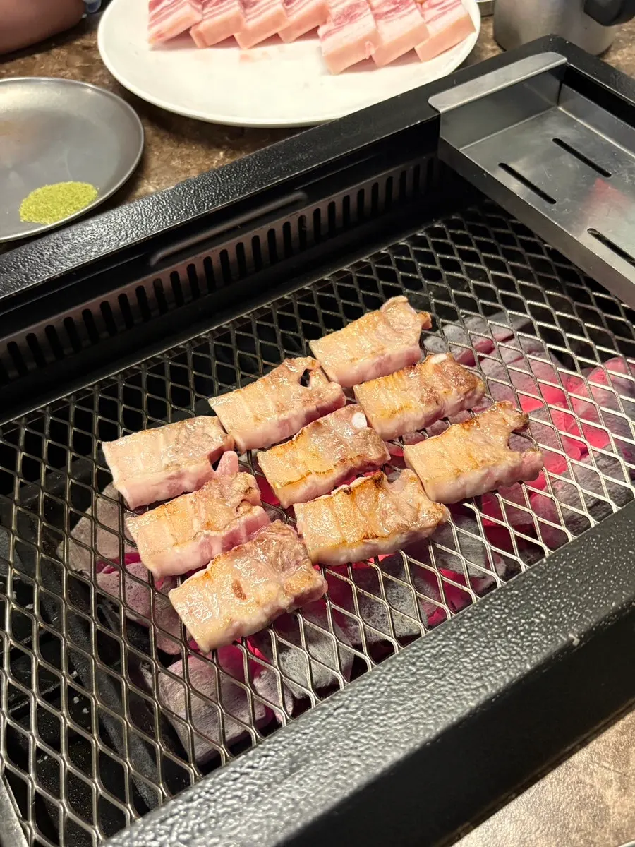 Pork belly on a binchotan charcoal grill