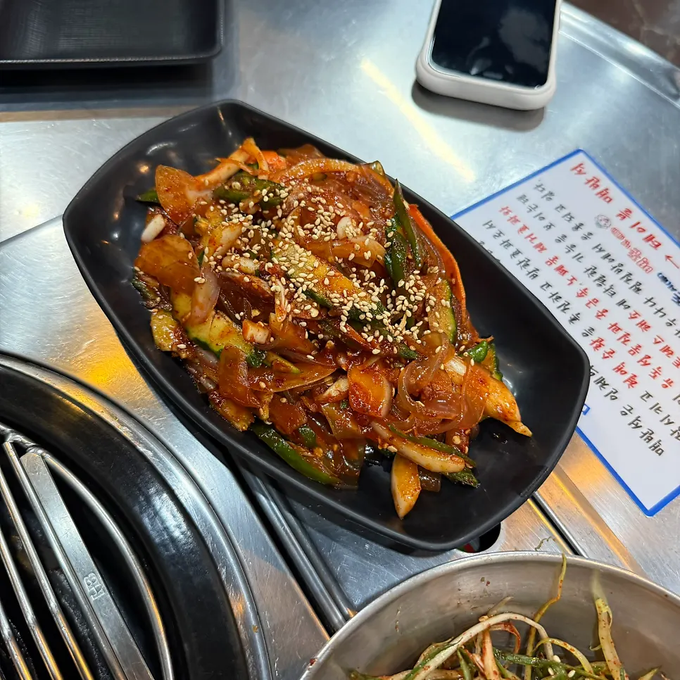 Dangmyeon-oi-muchim with cucumber, onion, and flat glass noodles