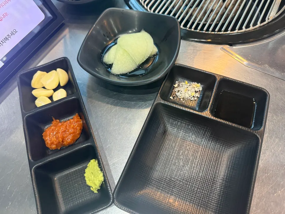 Full table spread with black pork geungogi and basic side dishes