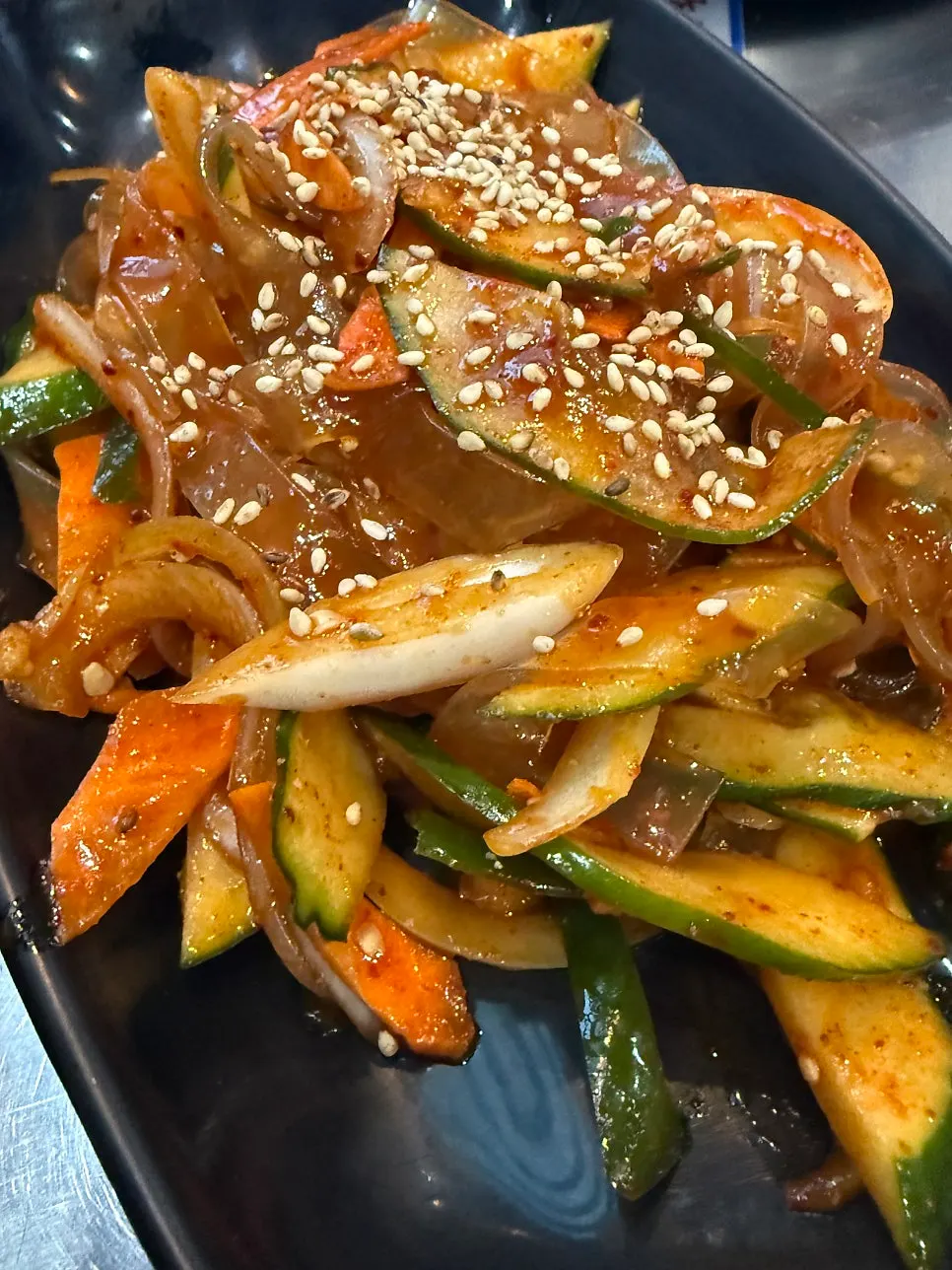 Glass noodle cucumber salad served first