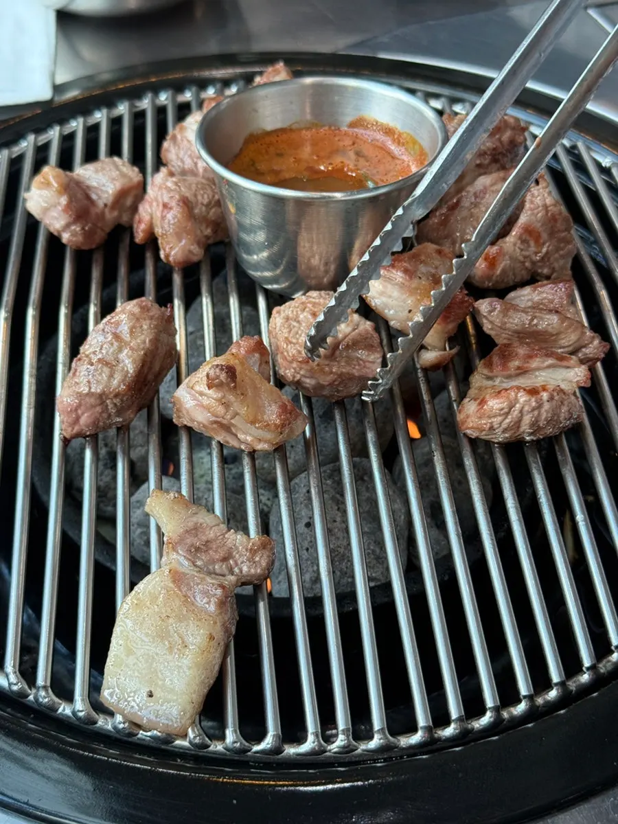 A tender bite of grilled black pork neck