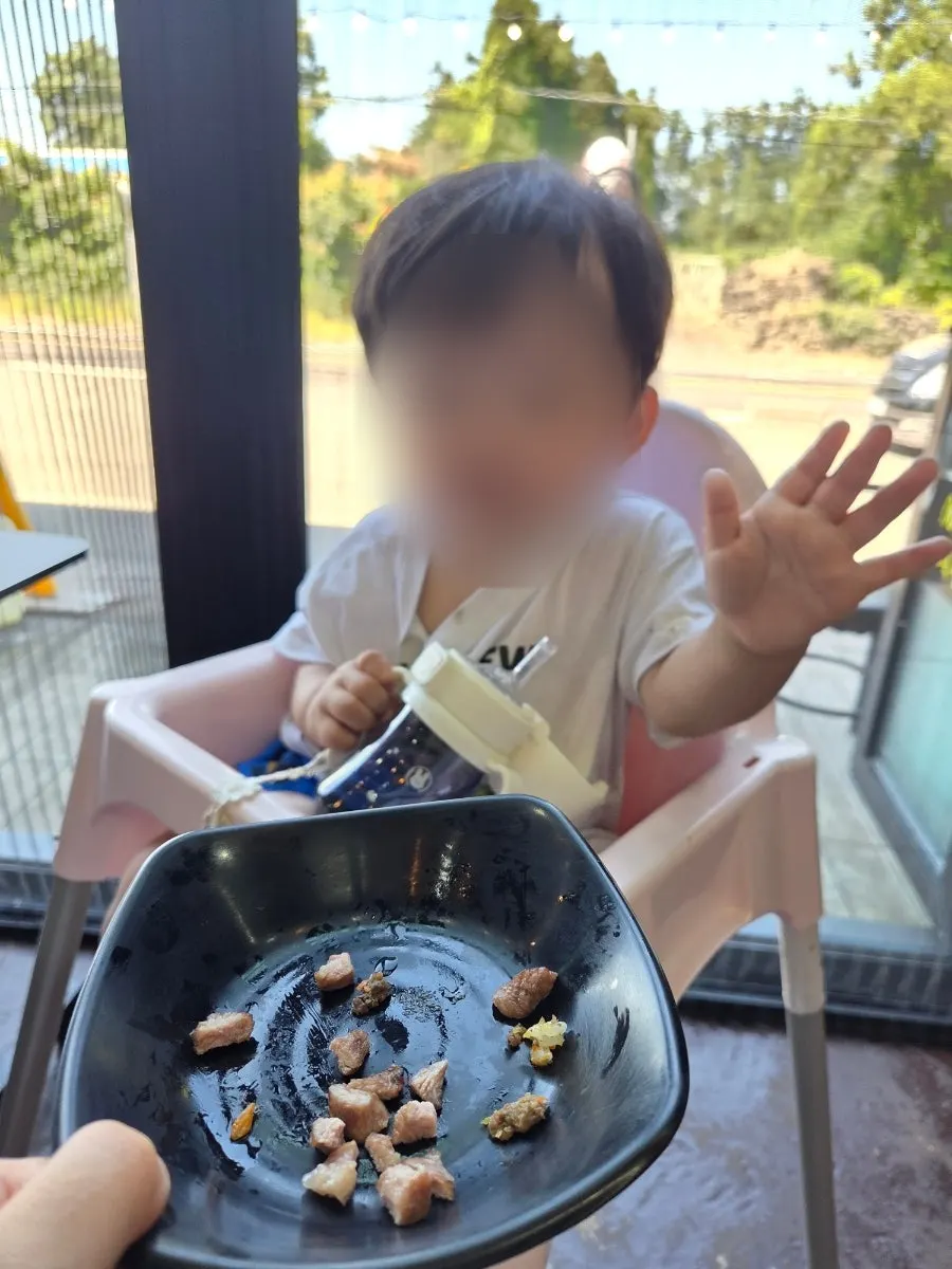 Baby enjoying the black pork