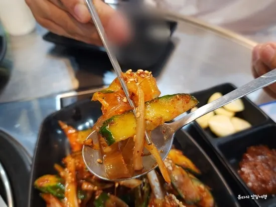 Plate of flat glass noodles mixed with cucumber