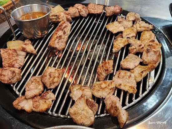 Pre-grilled raw pork ribs served at the table