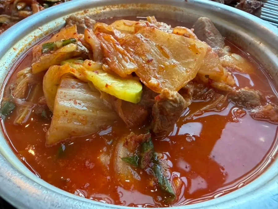 Kimchi stew with black pork and a bowl of rice