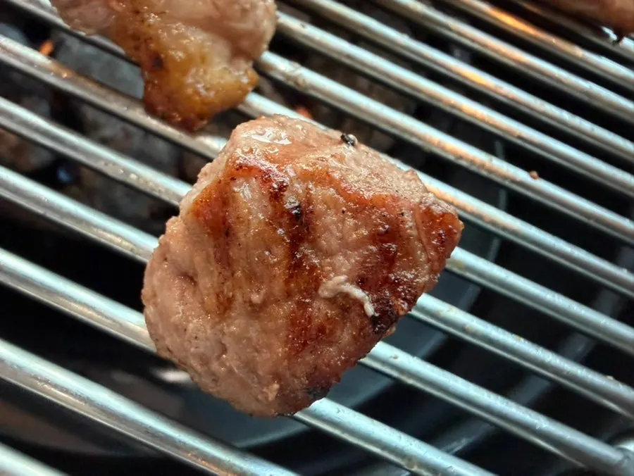 A thick piece of black pork neck meat