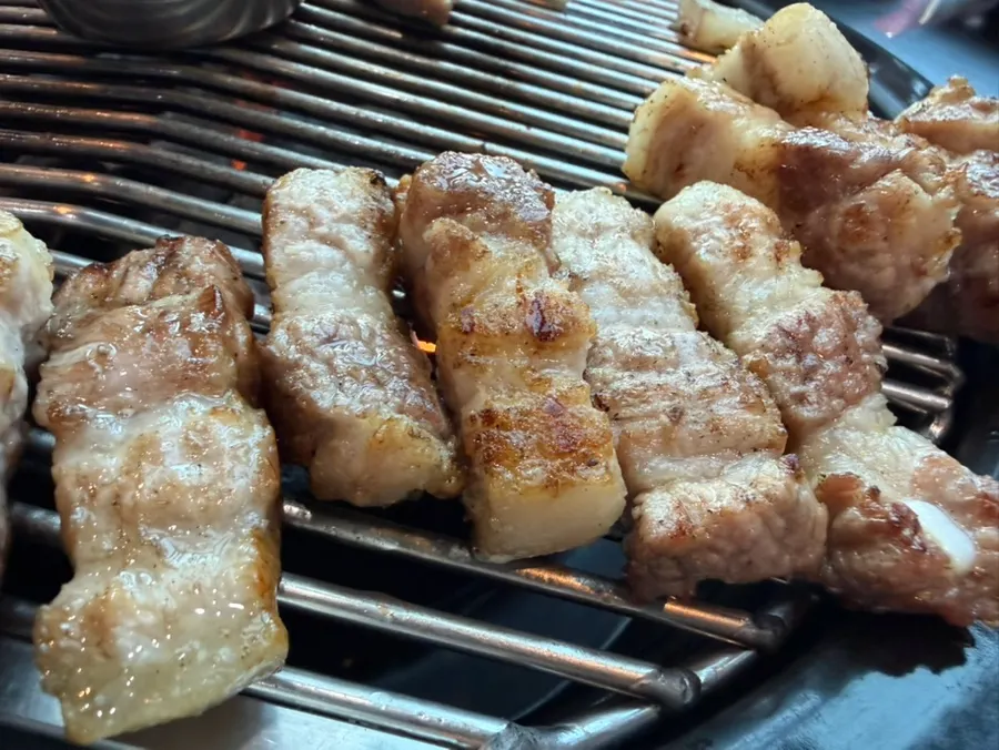 Black pork belly served cut by cut