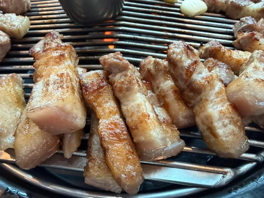 Jeju white pork belly served next