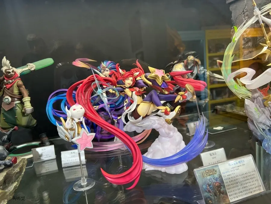 Collection of anime character figures on display