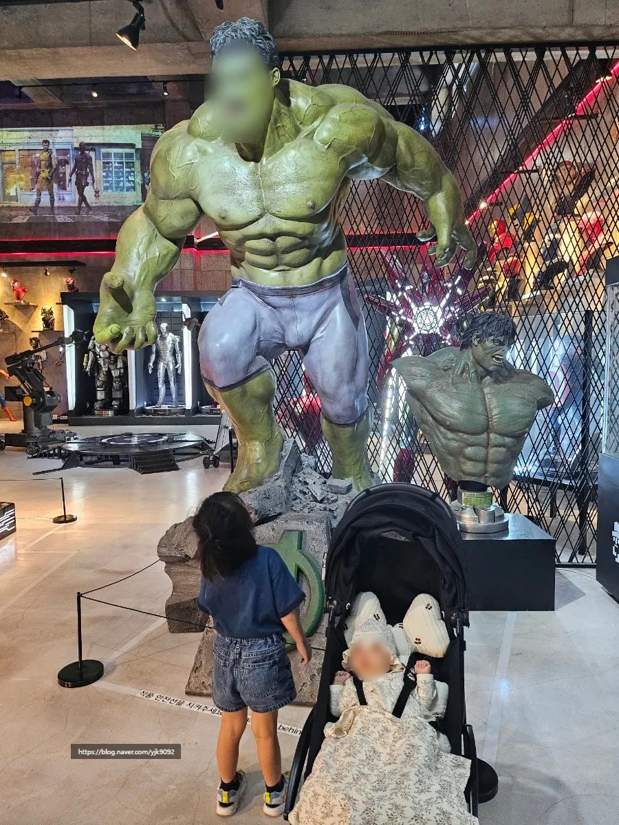 Child looking around the figure exhibit space