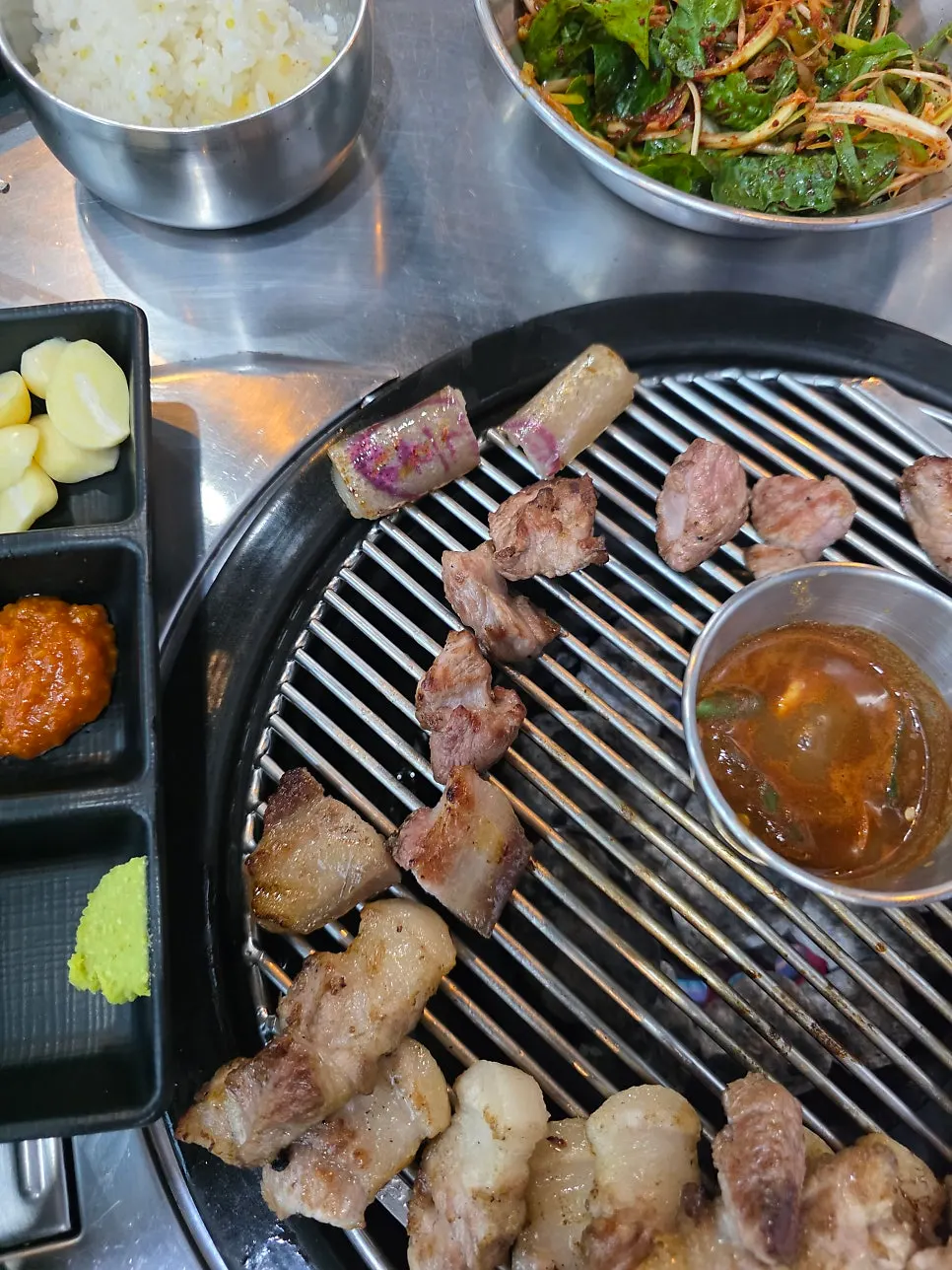 Black pork belly cut over charcoal