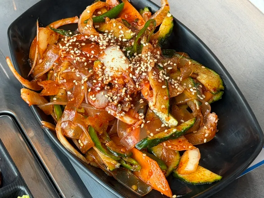 A plate of the signature glass noodle cucumber salad