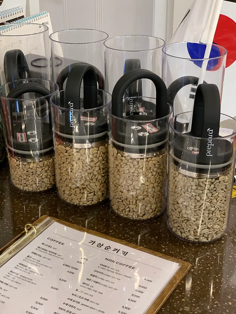 Display of green coffee beans before roasting