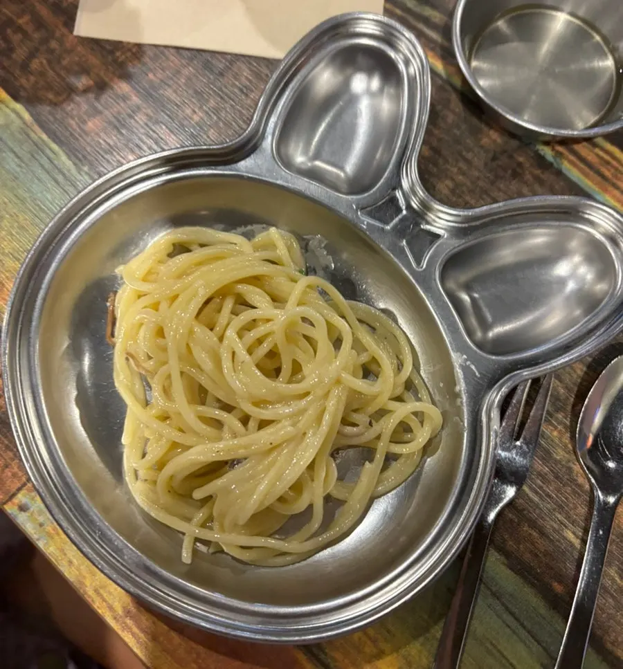 Mushroom cream pasta lifted up with a fork