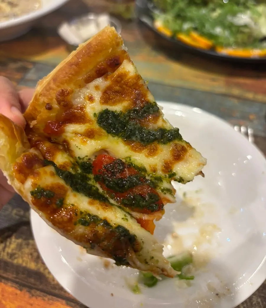 Eating the gorgonzola pizza