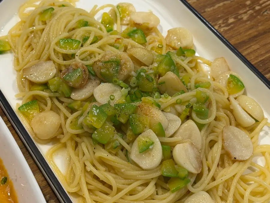 Aglio e olio topped with zucchini