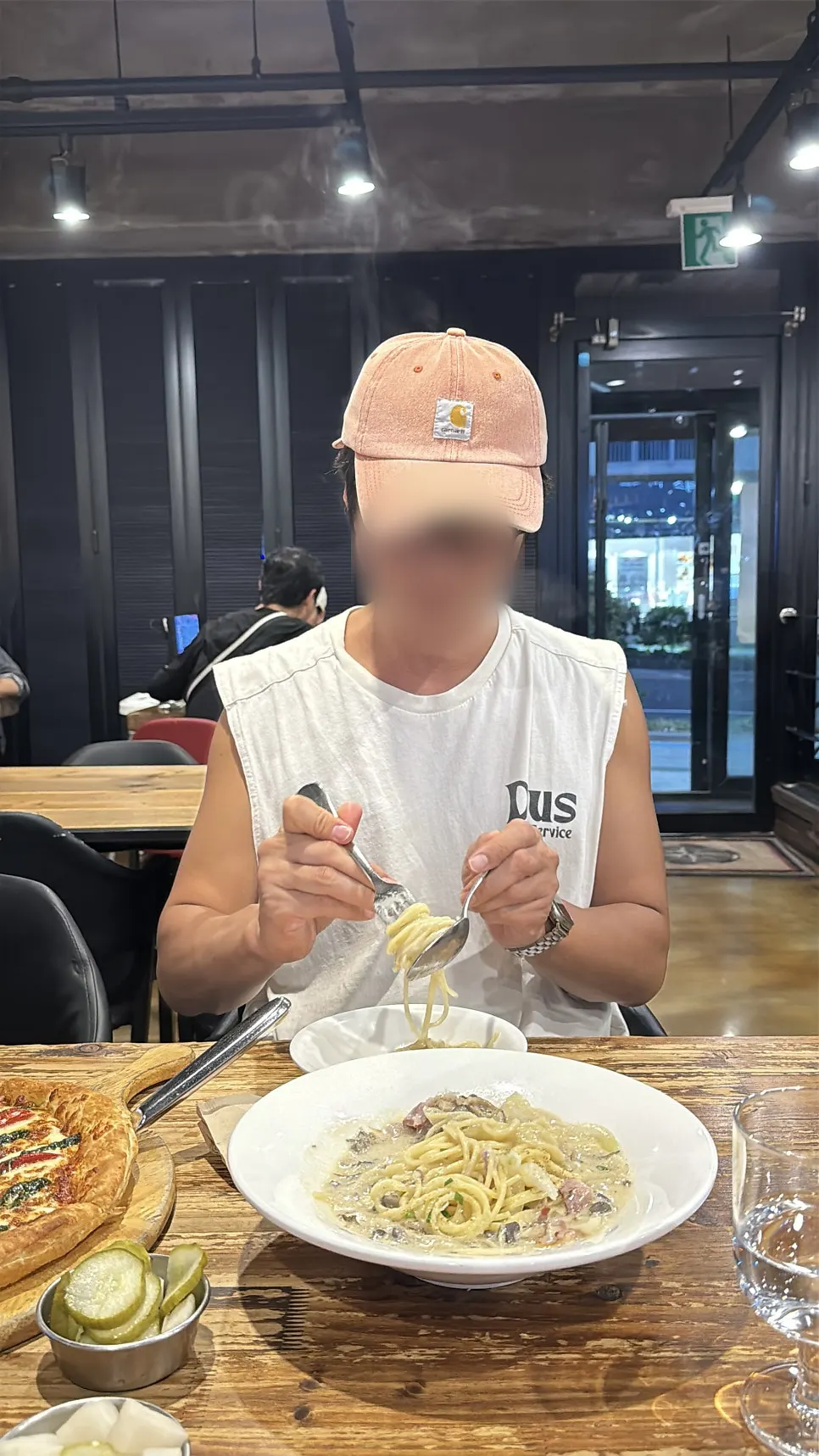 Family sharing cream pasta together