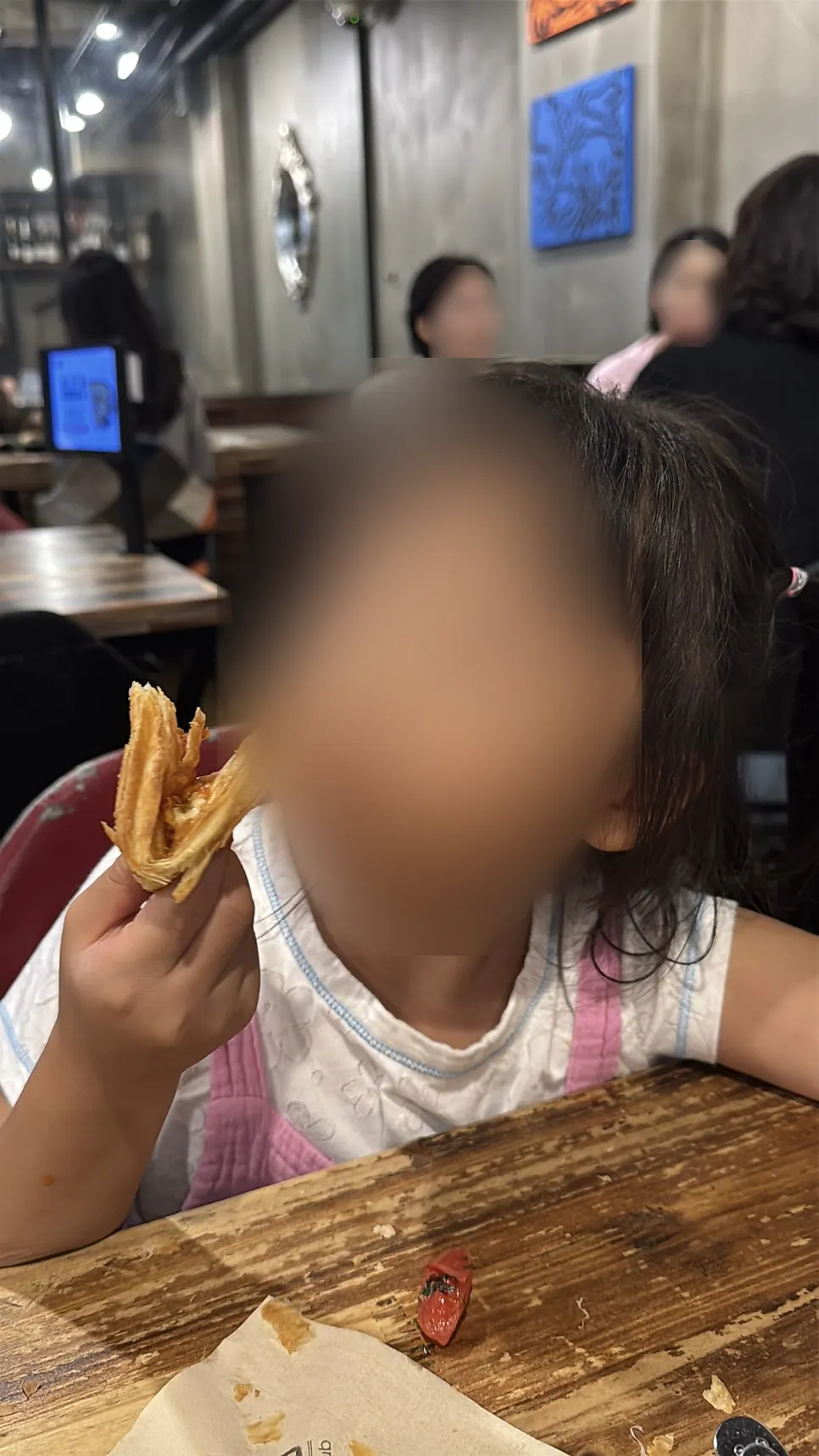 A child eating margherita pizza
