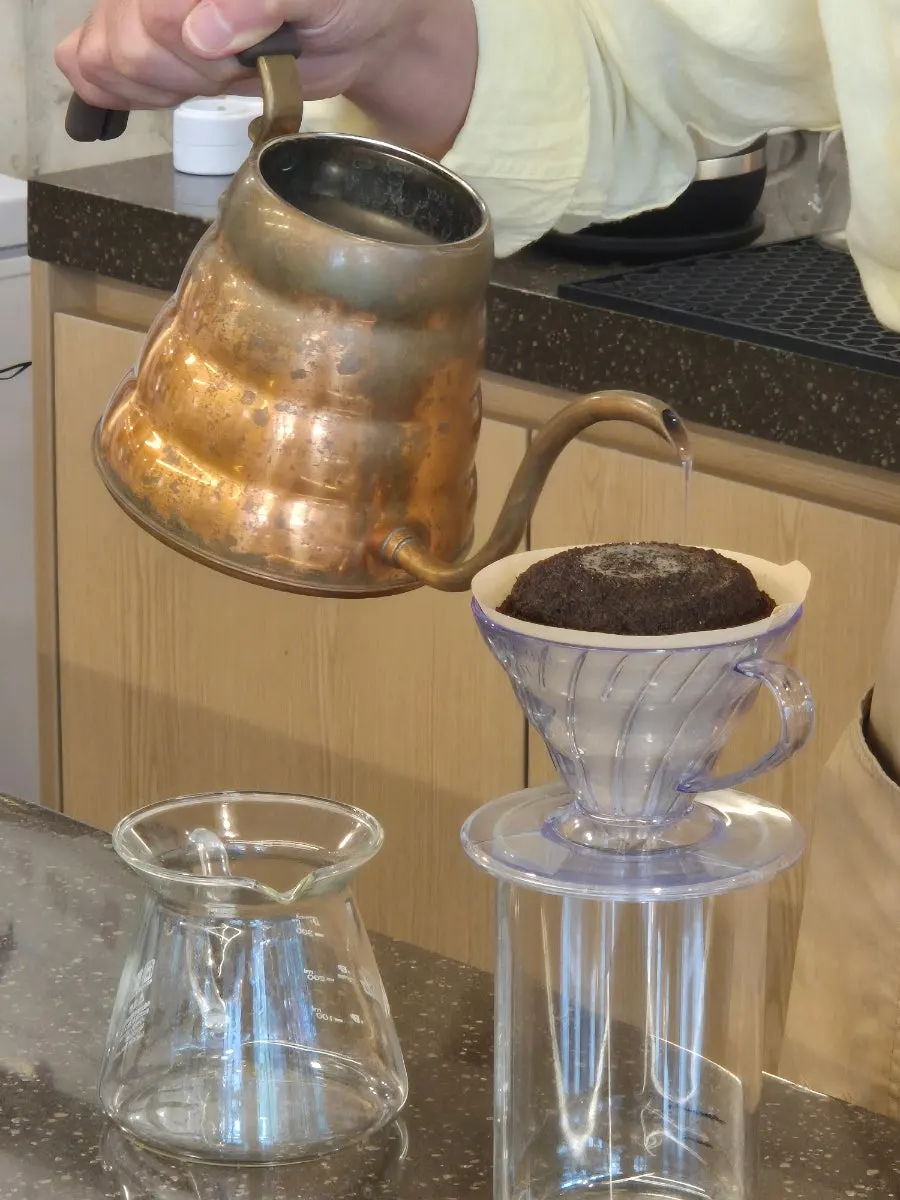 Hand-drip coffee served in a wine glass at Gasangsun Coffee