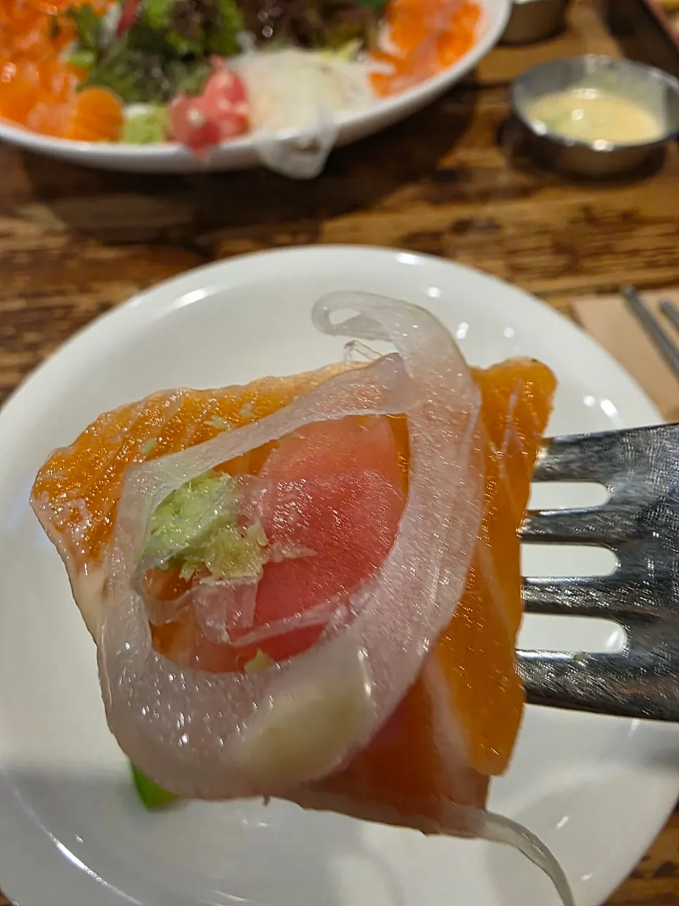 Close-up of the fresh raw salmon on the salad