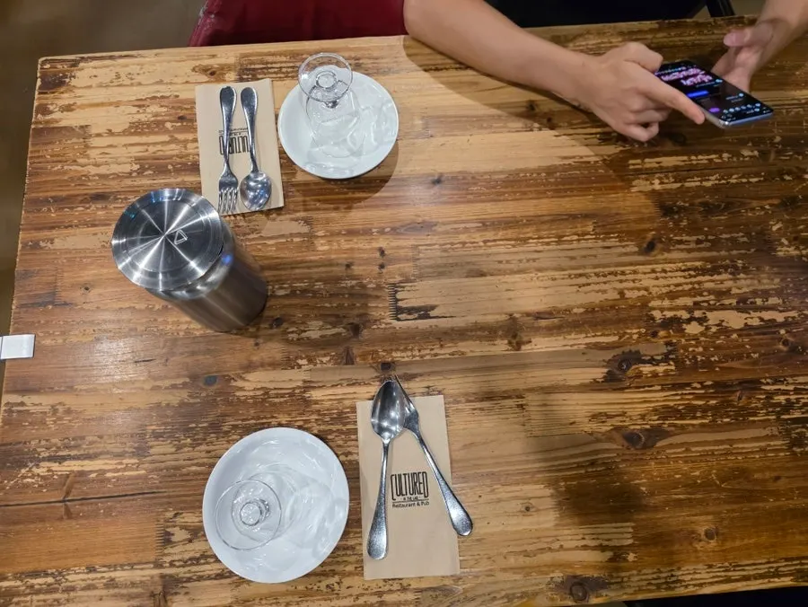 Wood-toned tables under soft lighting