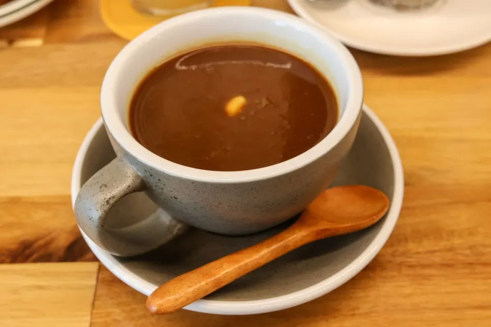 Signature gamastercoffee topped with ice cream and cinnamon powder