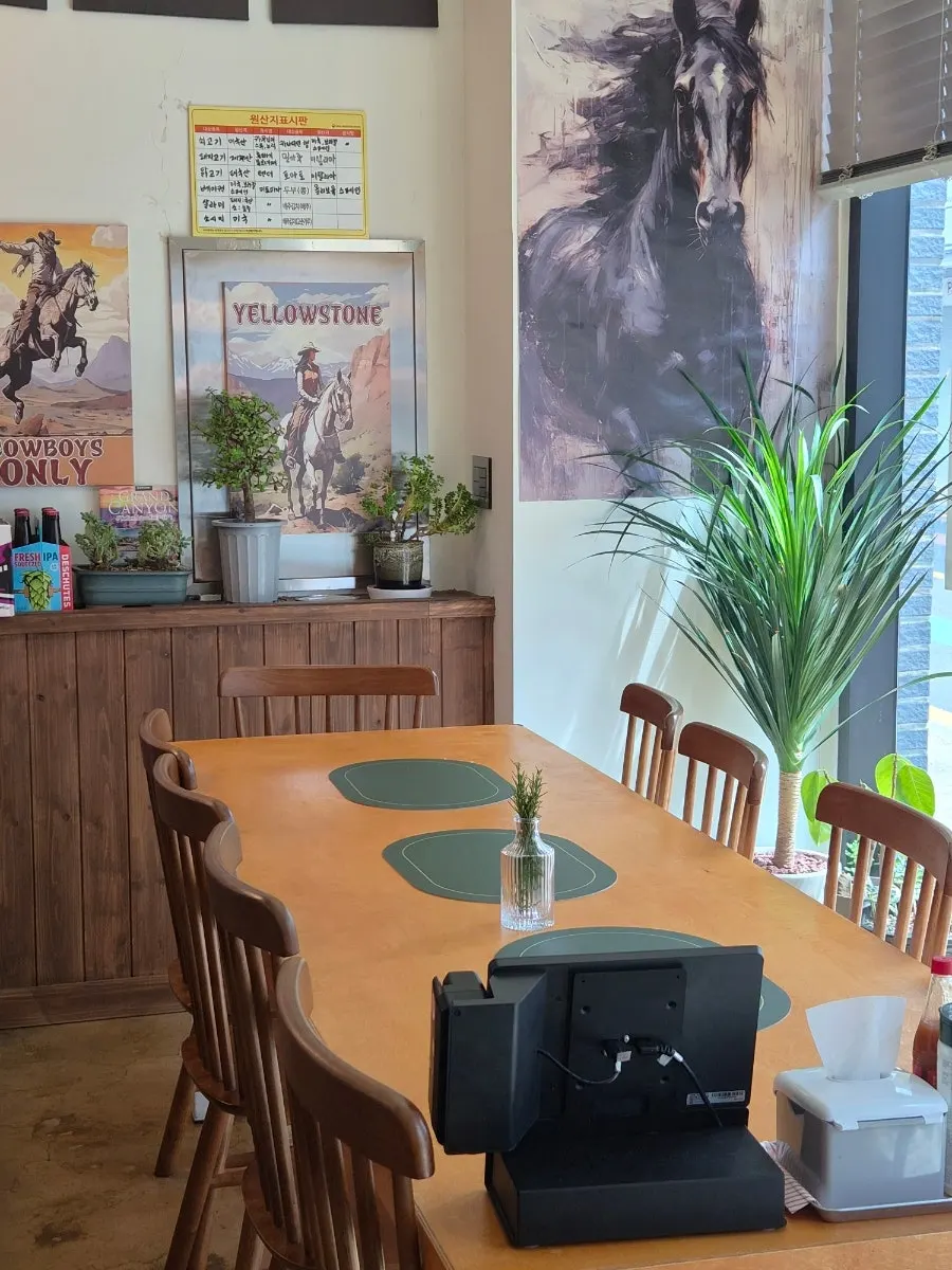 Restaurant interior with posters and oak barrels