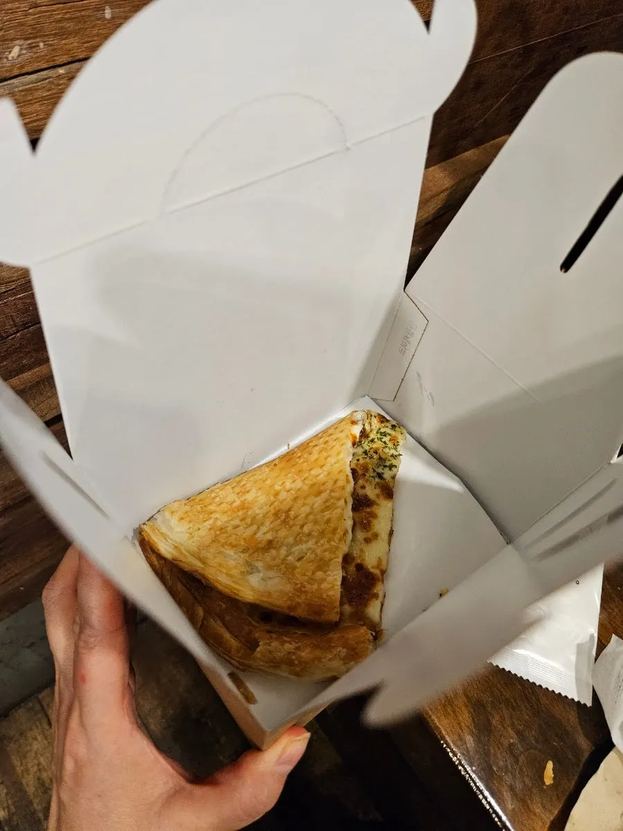 Thin-crust gorgonzola pizza dipped in honey