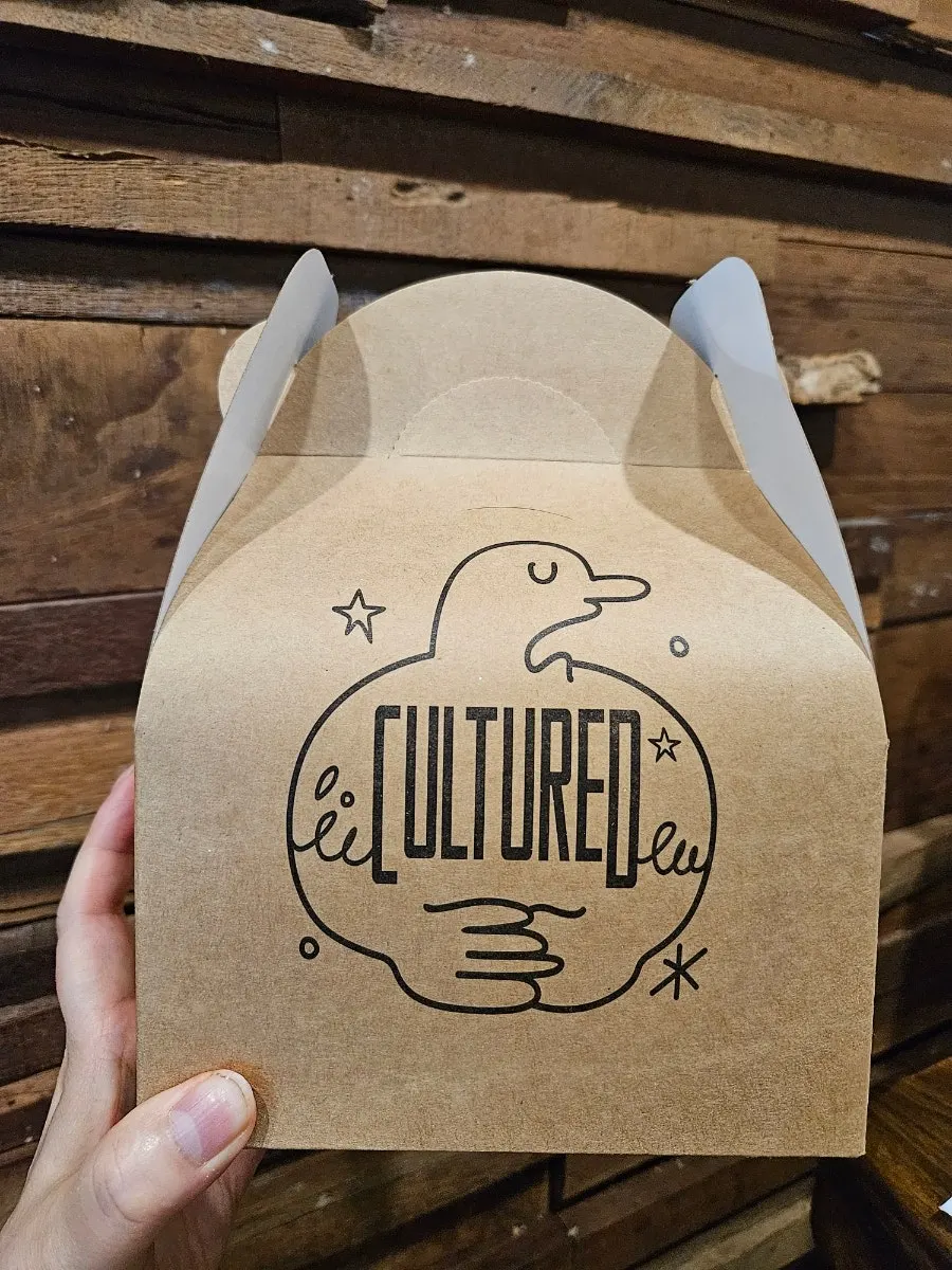 Takeout box for Cultured's leftover pizza