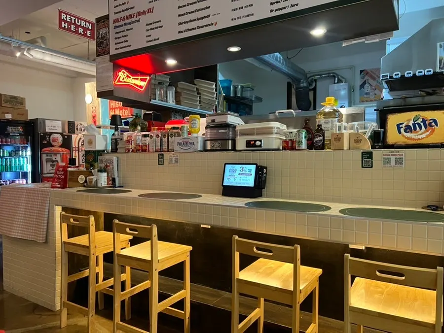 Table seating further inside the restaurant