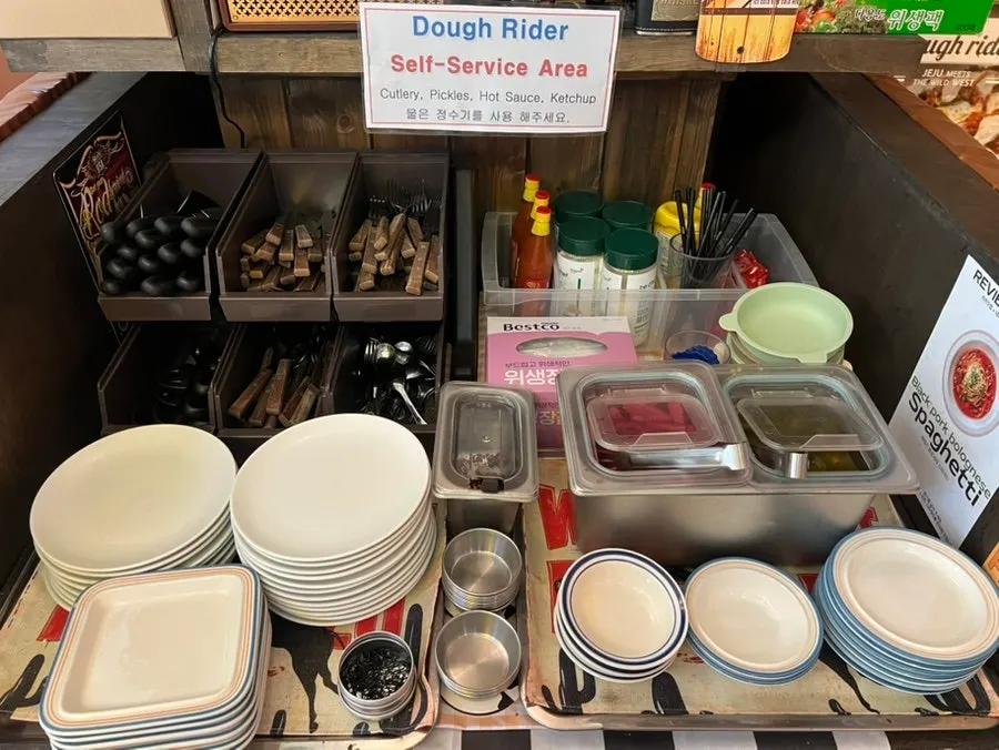 Menu board at Dough Rider Pizza