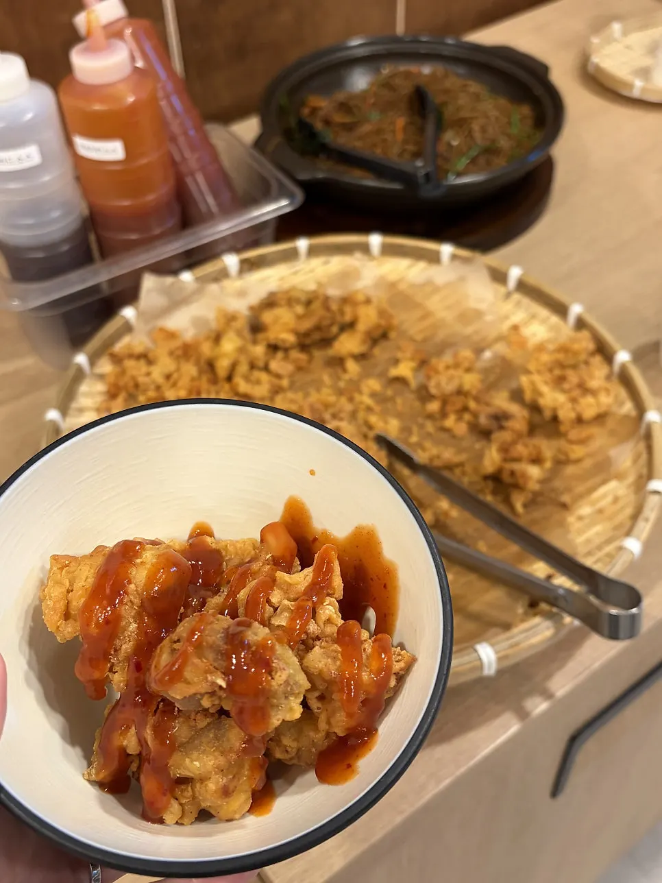 A plate of chicken drizzled with seasoned sauce