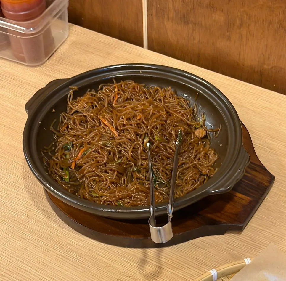 A plate of side dishes gathered from the self-serve bar