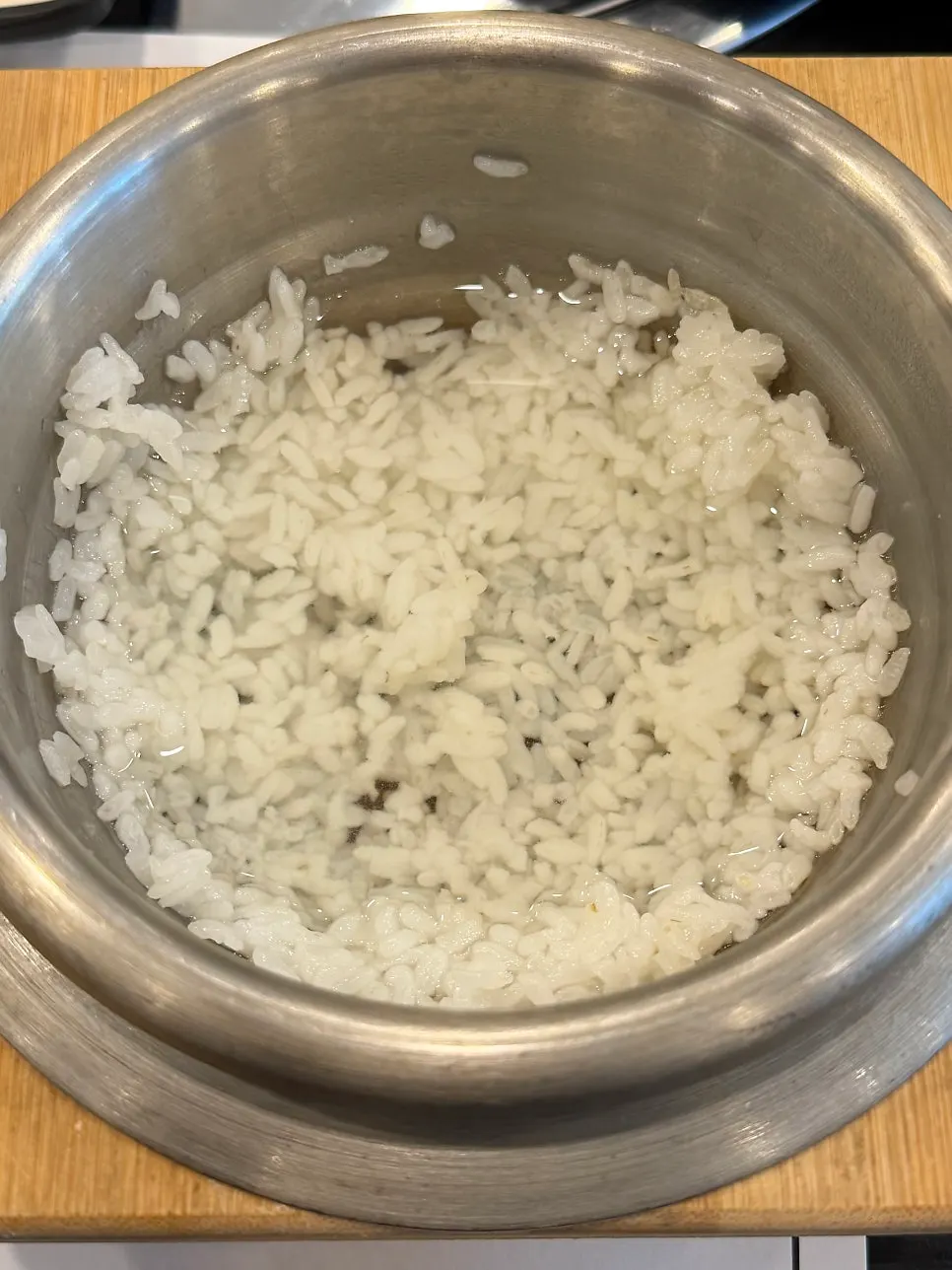 Table setting with pot rice and side dishes together