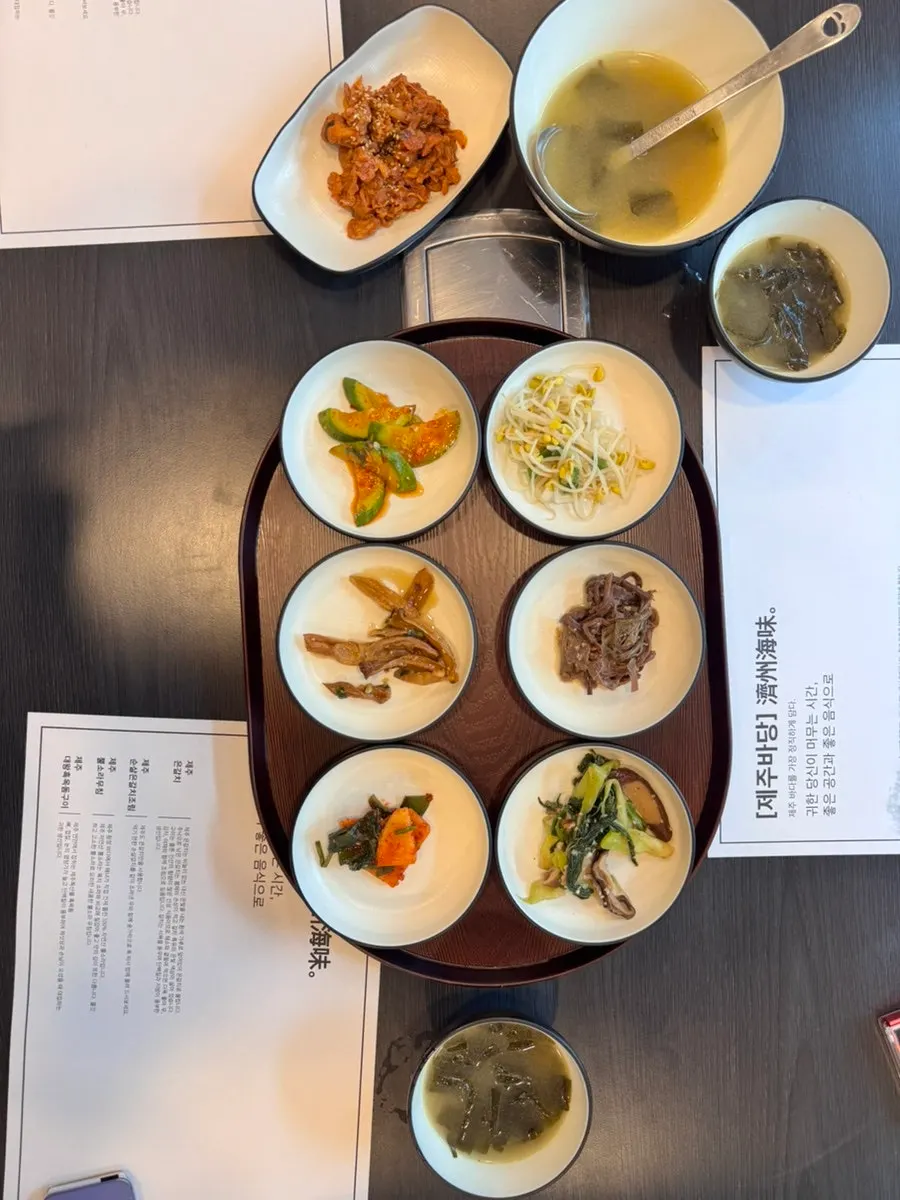 Basic side dishes set at the table at Jeju Badang