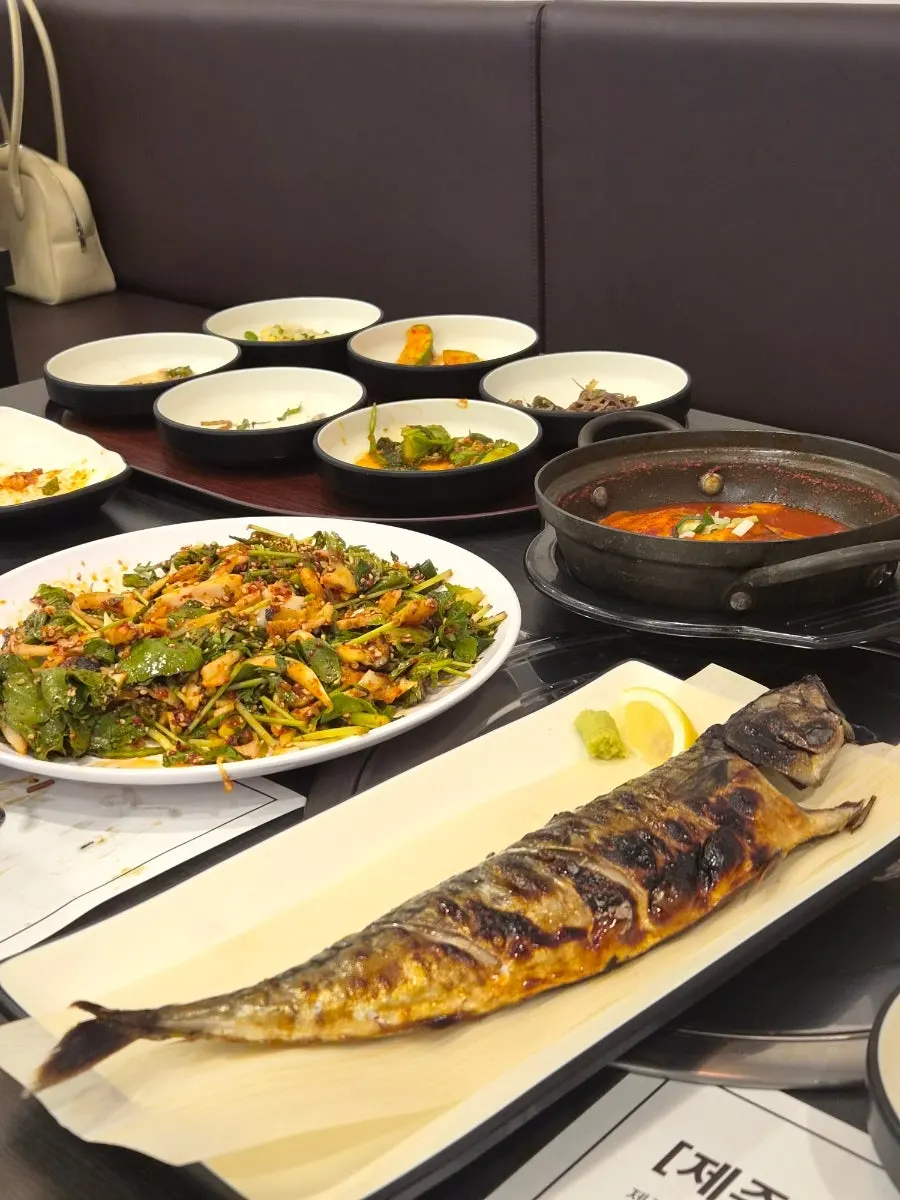 Full table set with grilled mackerel and boneless hairtail stew