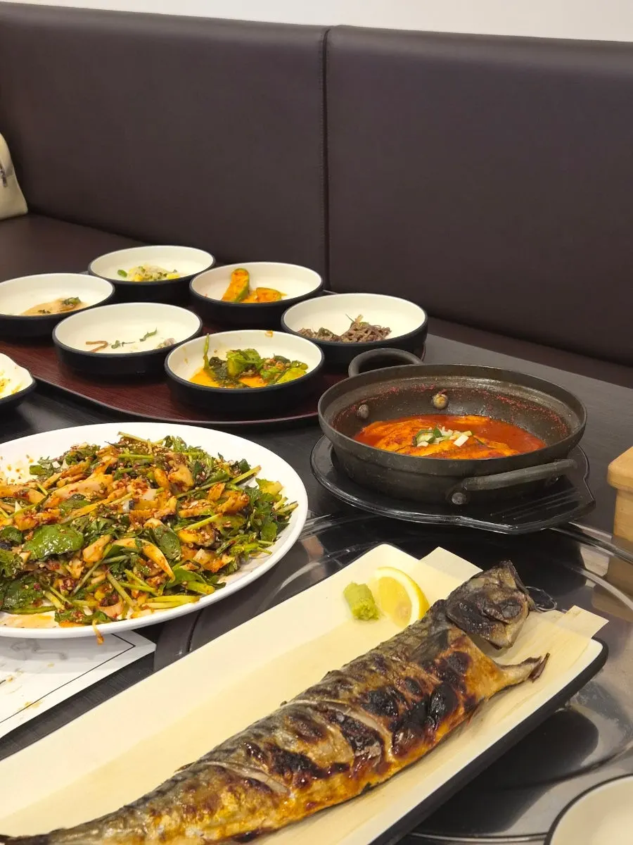 Table at Jeju Badang packed full of side dishes