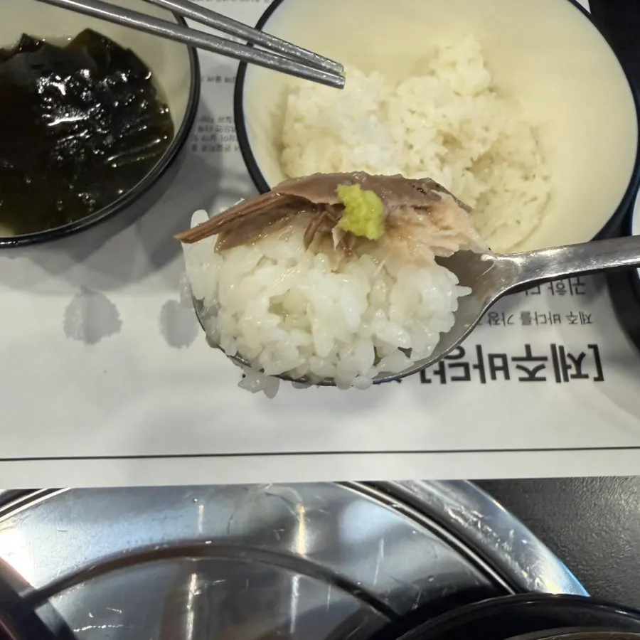 Piece of grilled mackerel placed on rice