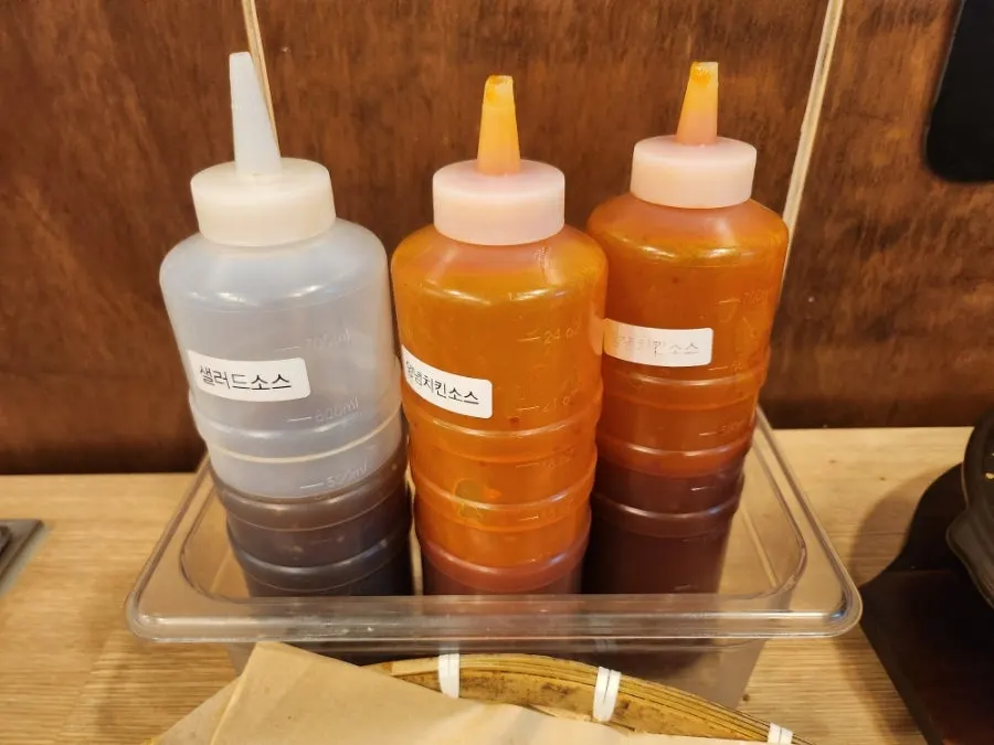Self-serve bar with chicken seasoning sauce