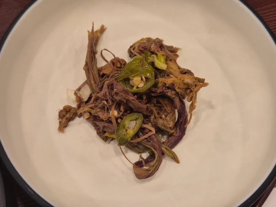 A piece of mackerel laid on top of pot rice