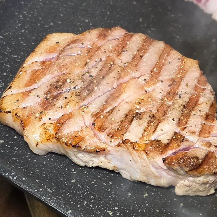 Black pork and black tiger shrimp on the grill