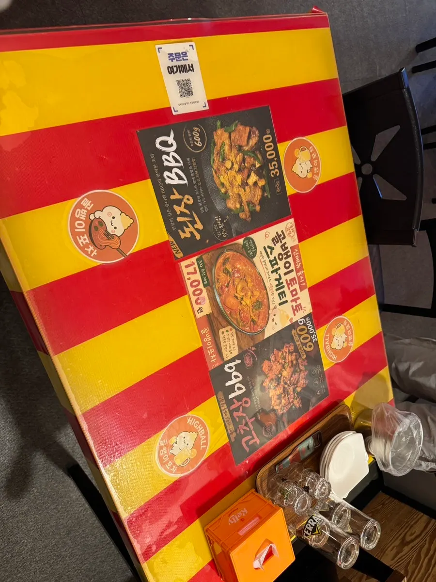 Pocha interior with red and yellow tables