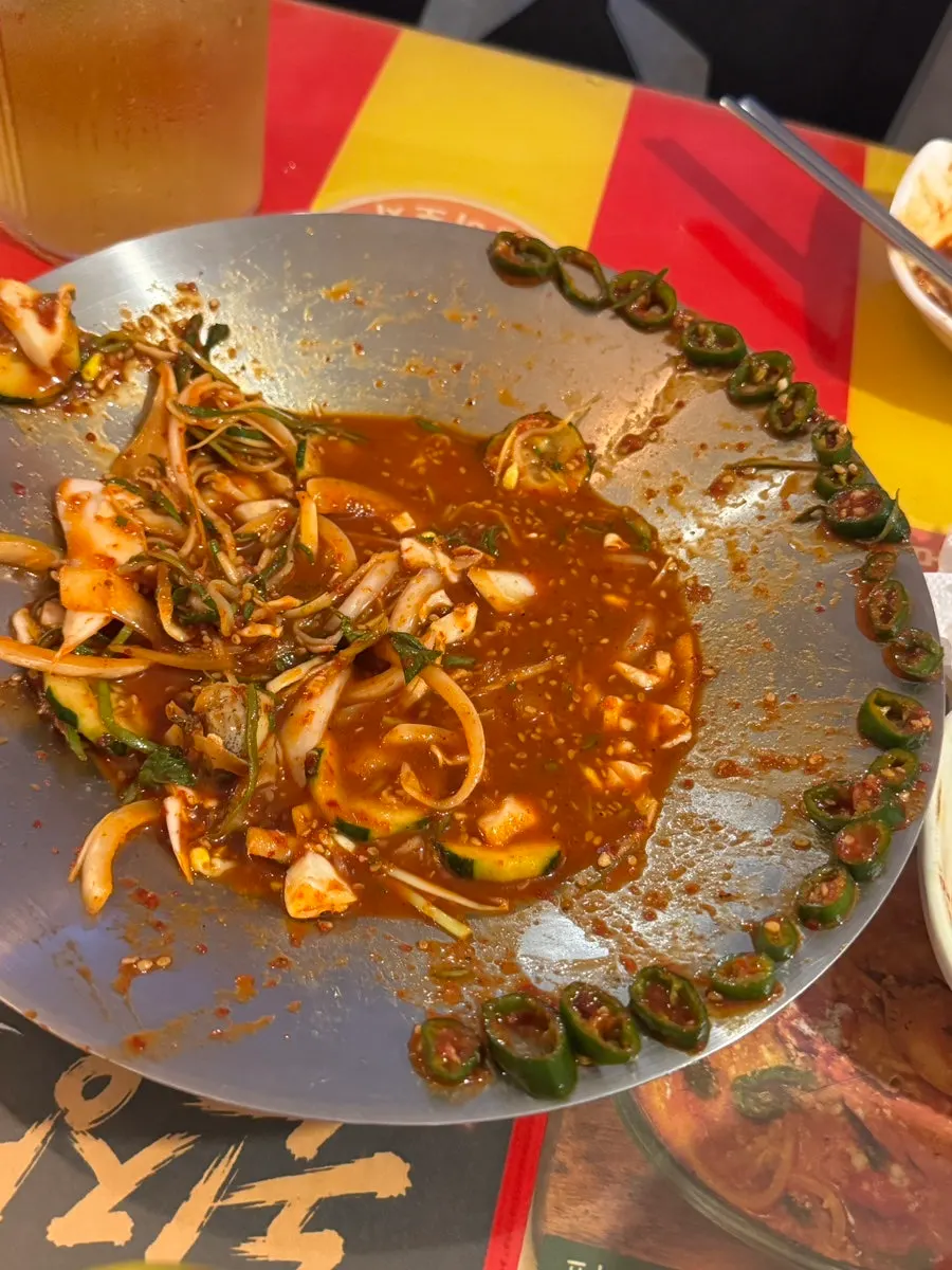 Somyeon noodles and whelk salad mixed in the dressing