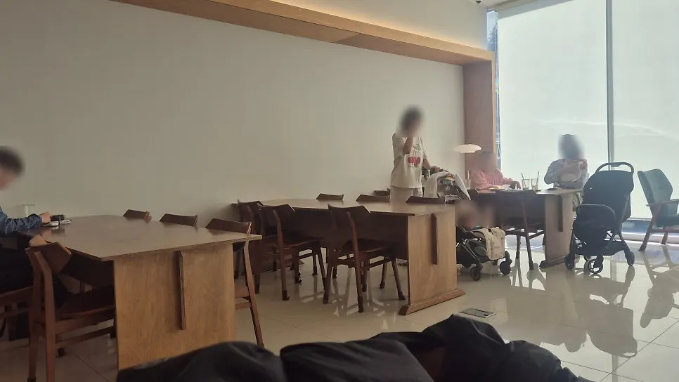 Wooden table seating with generous spacing