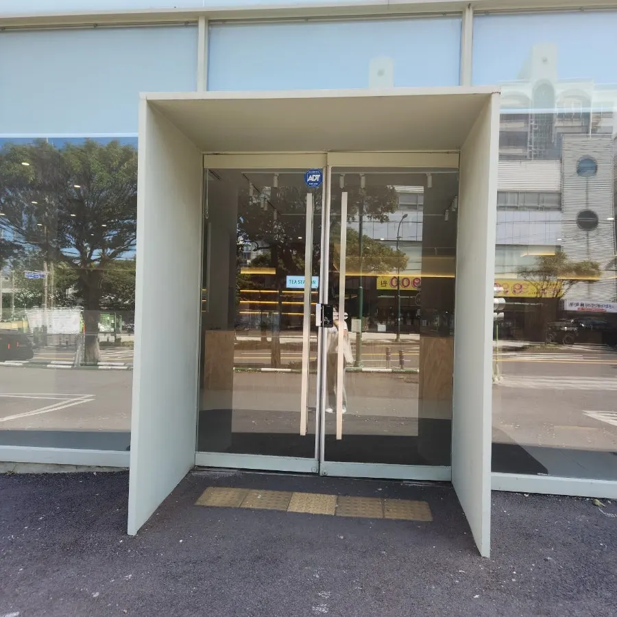 Wide parking area in front of Dobana's entrance