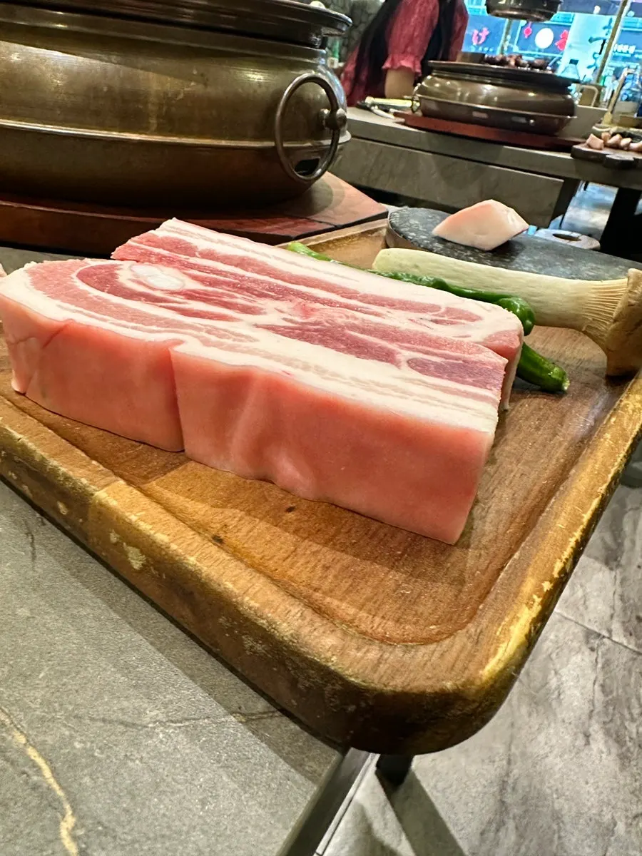 Fresh oegyeopsal plated before grilling
