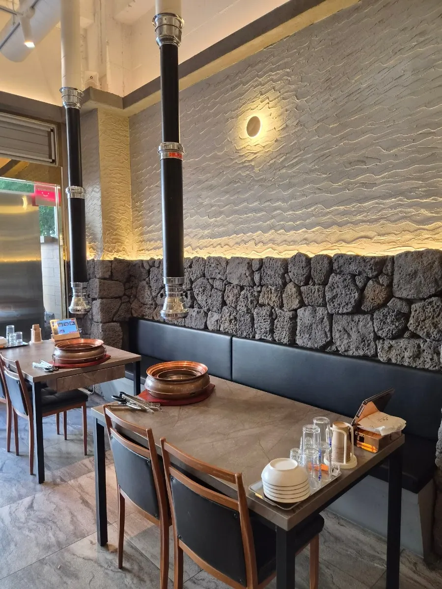 Wall interior styled to look like Jeju basalt